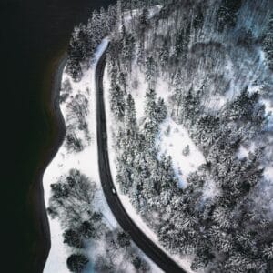 An aerial view of a snow covered forest